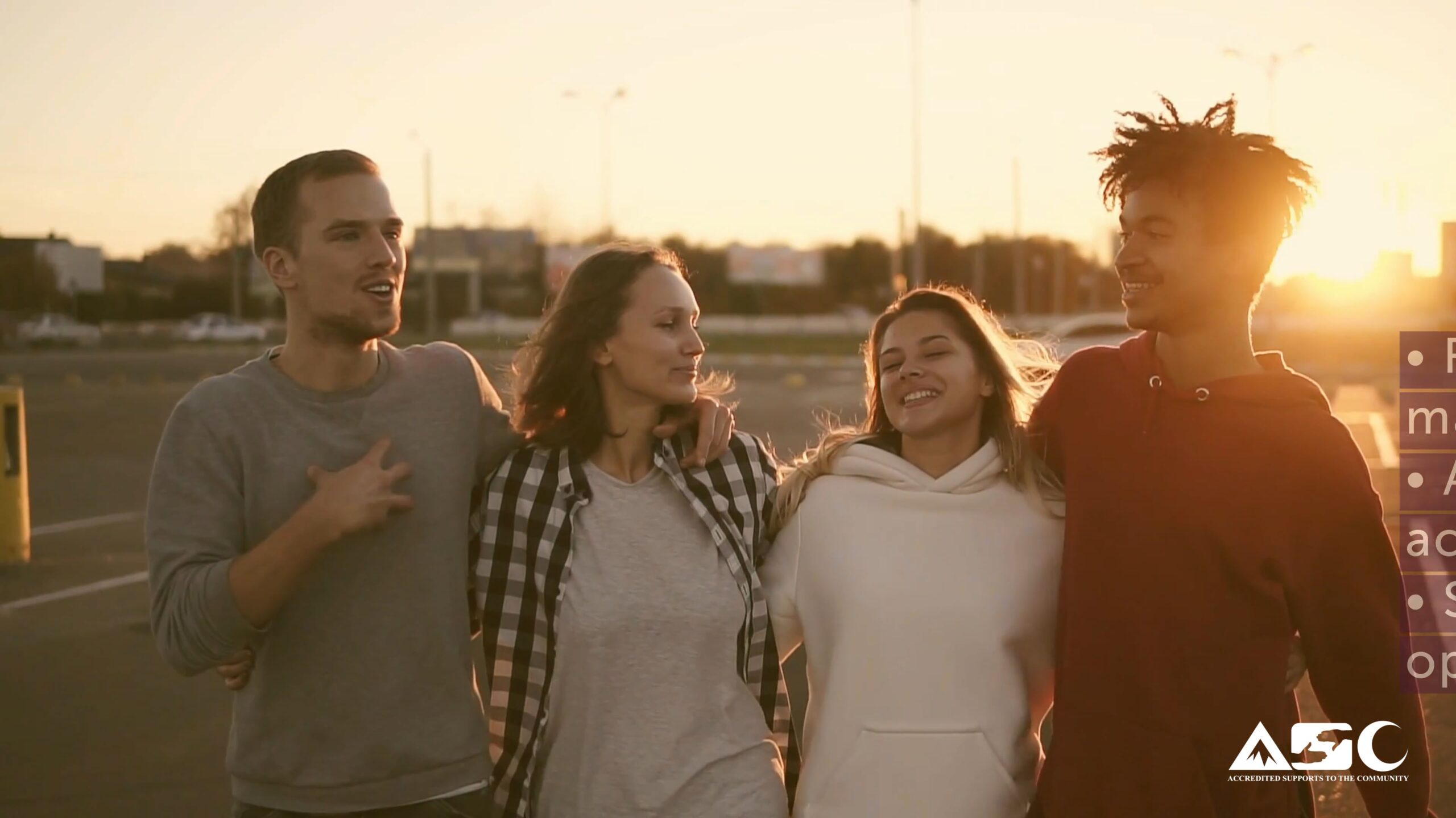 sunset photo of 4 young adults walking together
